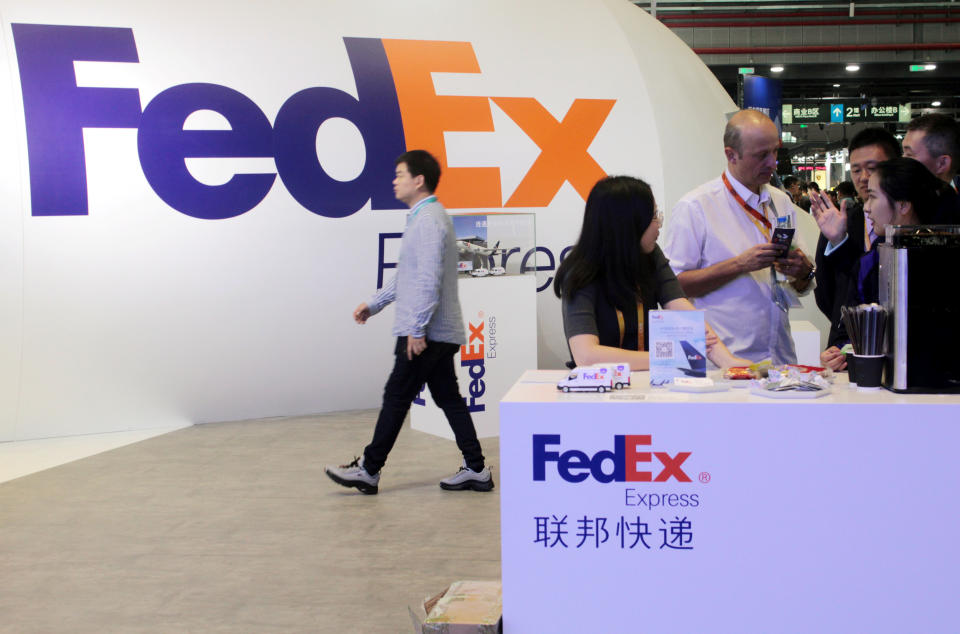 People visit a FedEx Express booth during the China International Import Expo (CIIE) at the National Exhibition and Convention Center in Shanghai, China November 7, 2018. Picture taken November 7, 2018. REUTERS/Stringer  ATTENTION EDITORS - THIS IMAGE WAS PROVIDED BY A THIRD PARTY. CHINA OUT.