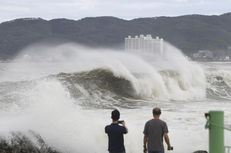 Waves hit a shore in Ulsan, South Korea, Tuesday, Sept. 6, 2022. The most powerful typhoon to hit South Korea in years battered its southern region Tuesday, dumping almost a meter (3 feet) of rain, destroying roads and felling power lines, leaving 20,000 homes without electricity as thousands of people fled to safer ground. (Kim Yong-tai/Yonhap via AP)