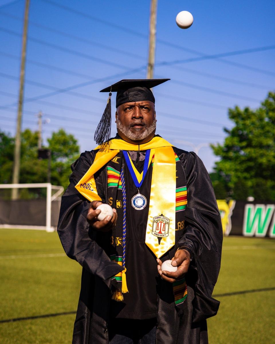 Frank Burton, Jr., poses for a photo after to mark graduating from Wilmington University with a master's degree in spring 2023.