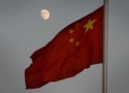 The Chinese flag flies over Tiananmen Square in Beijing