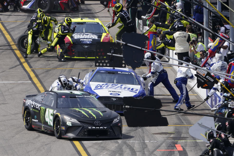 FILE -Kurt Busch (45) pits during a NASCAR Cup Series auto race at World Wide Technology Raceway, Sunday, June 5, 2022, in Madison, Ill. NASCAR’s next 75 years almost certainly will include at least a partially electric vehicle turning laps at Daytona International Speedway. It’s unfathomable to some, unconscionable to others. (AP Photo/Jeff Roberson, File)