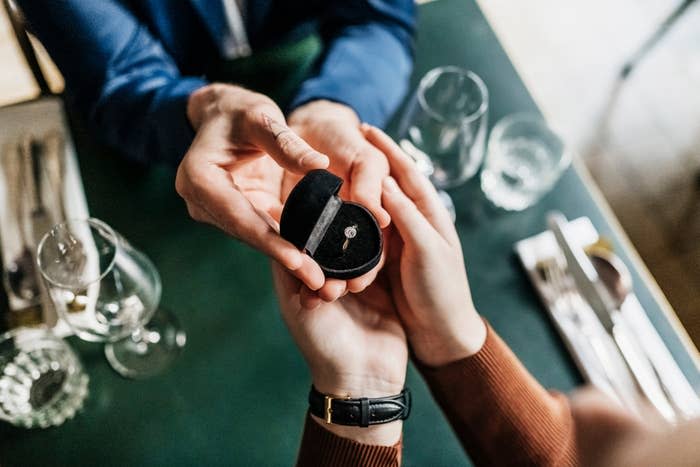 A man is proposing to his girlfriend