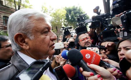 Mexican President-elected Andres Manuel Lopez Obrador talks to journalists as he arrives to a meeting with his new cabinet in Mexico City, Mexico July 7, 2018. REUTERS/Daniel Becerril