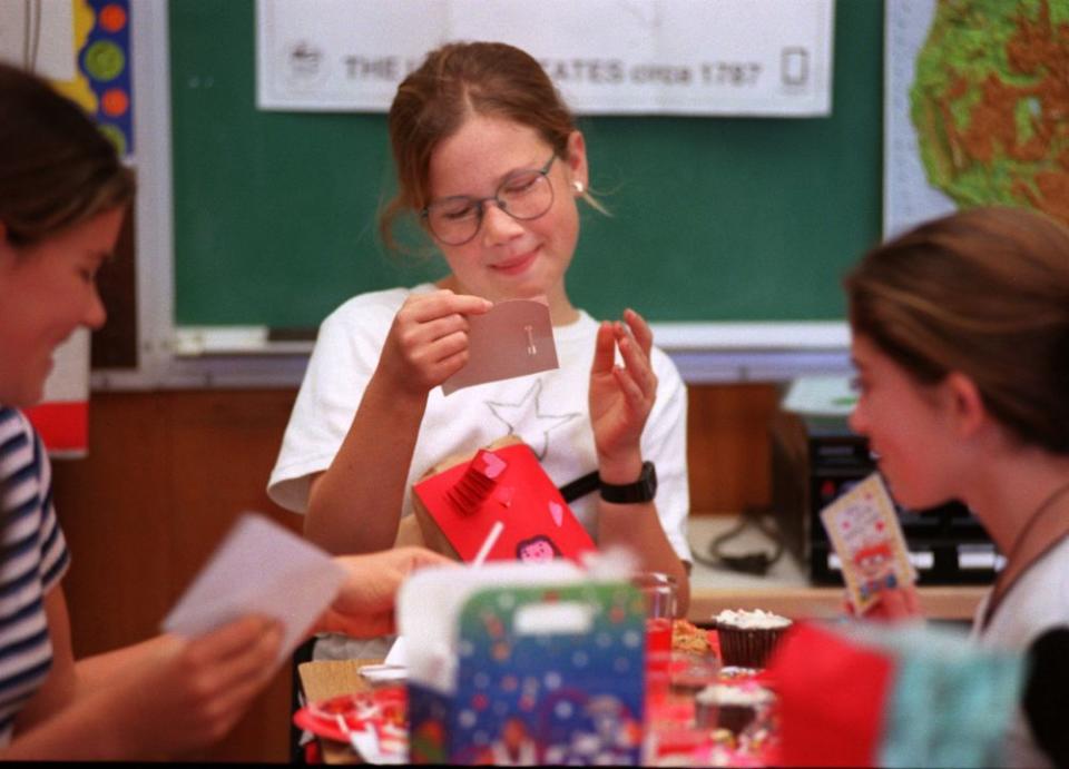 Jasie Sharp, 10, ponders her Valentine’s Day cards at party at JuanaMaria Elementary in Los Angeles in 1997.