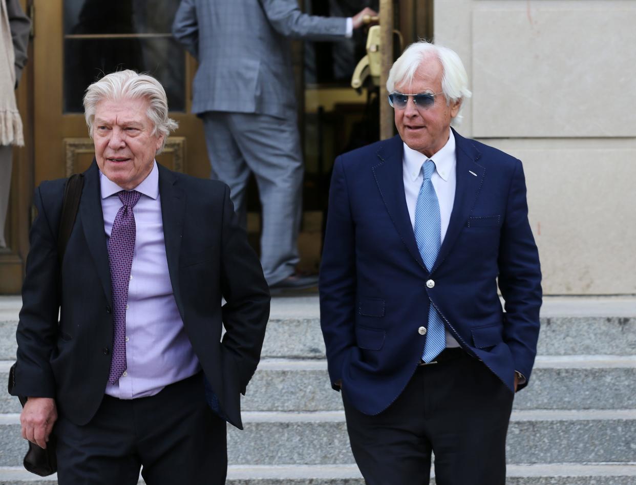 Hall of Fame trainer Bob Baffert (right) exits U.S. District Court in Louisville on Feb. 2, 2023, along with his attorney, Clark Brewster. Along with his attorney career, Brewster also is a thoroughbred owner. He's one of four co-owners of 2024 Kentucky Derby contender Track Phantom.