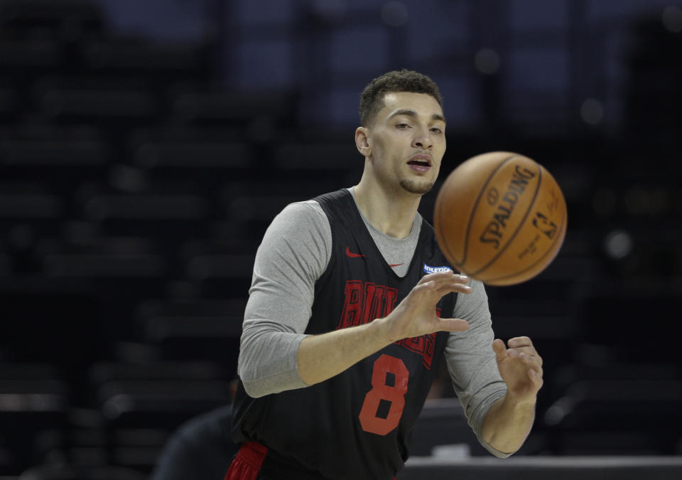 Guard Zach LaVine catches a pass during a Chicago Bulls basketball practice at Mexico City Arena in Mexico City, Wednesday, Dec. 12, 2018. The Bulls will face Orlando Magic on Thursday in the first of two 2018 regular-season NBA games to be played in the high-altitude Mexican capital. (AP Photo/Rebecca Blackwell)