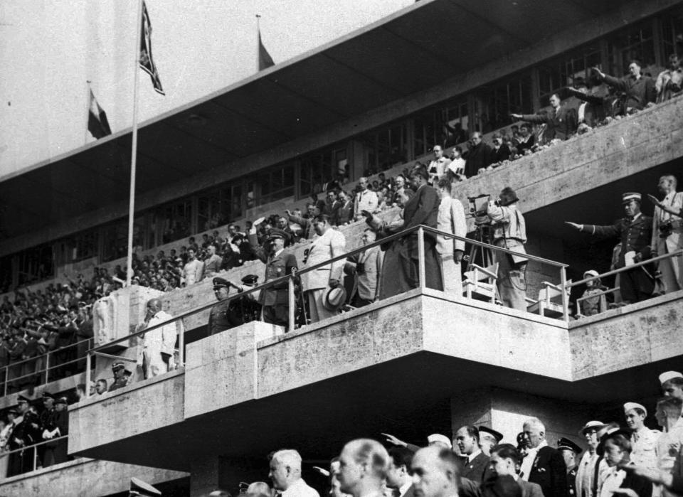 FILE - In this Aug. 2, 1936 file photo Adolf Hitler and Colonel General Hermann Goering are on the grand stand in the stadium watching the events on the field at the Olympics in Berlin. Scars of World War II and relics from its Nazi past are preserved at Berlin's Olympiastadion. When Spain plays England in the European Championship final, they will be playing in a stadium that doesn't hide it was built by the Nazis for the 1936 Olympic Games. (AP Photo, file)