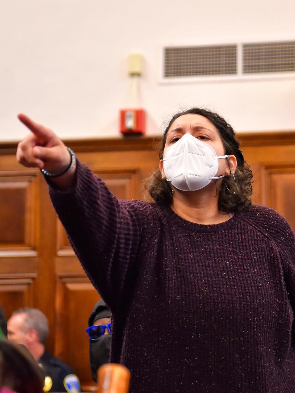 A woman reacts after the Rev. John Beaty is prevented from speaking Monday at the conclusion of Akron City Council's public comment session. Beaty was not permitted to speak because he wasn't signed up, and was escorted out of council chambers.