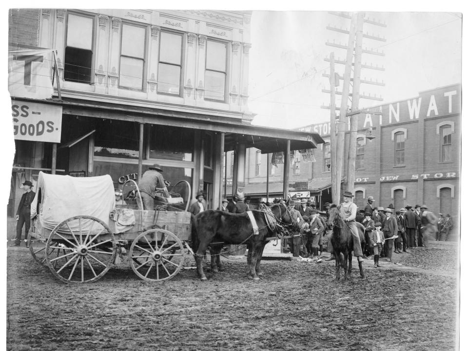 A horse drawn wagon in a small town in Arkansas in 1903.
