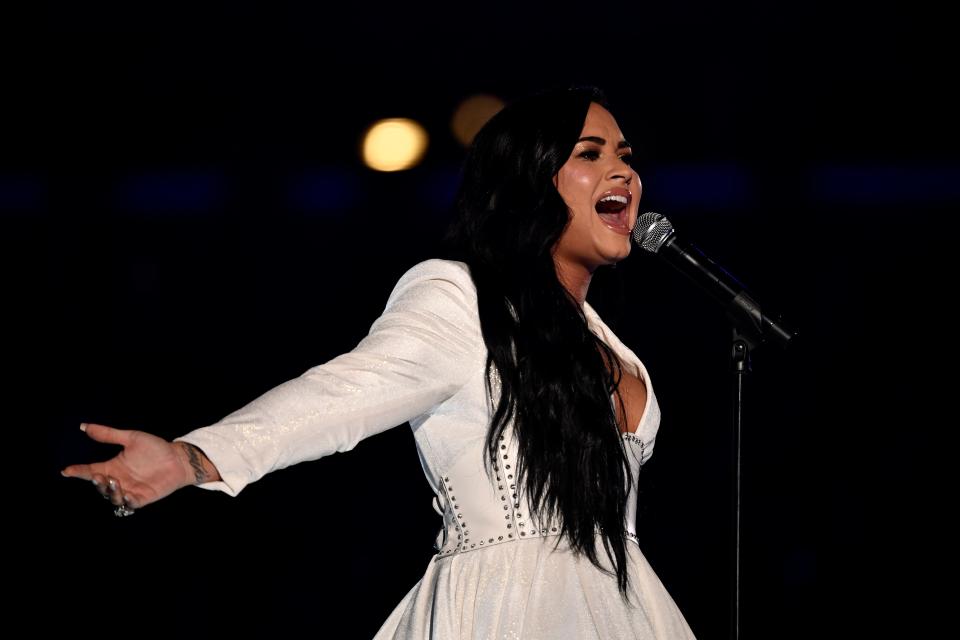 A visibly moved Demi Lovato belts "Anyone" at the Grammy Awards after choking up initially.