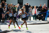 Ghirmay Ghebreslassie (L) of Eritrea leads the elite men's runners next to Lucas Rotich of Kenya (C) and Lelisa Desisa of Ethiopia as they cross the Ed Koch Queensboro Bridge during the 2016 New York City Marathon in the Queens borough of New York City, U.S. November 6, 2016. REUTERS/Eduardo Munoz