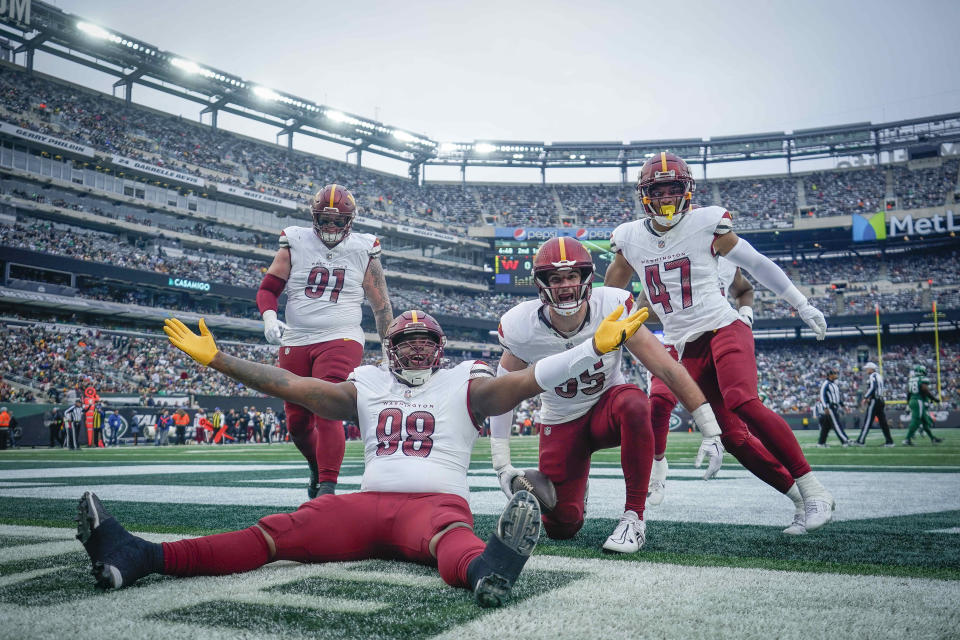 The Commanders may have lost to the Jets Sunday, but they're probably smiling after the Patriots won and bumped them into the top three of the draft. (AP Photo/Bryan Woolston)