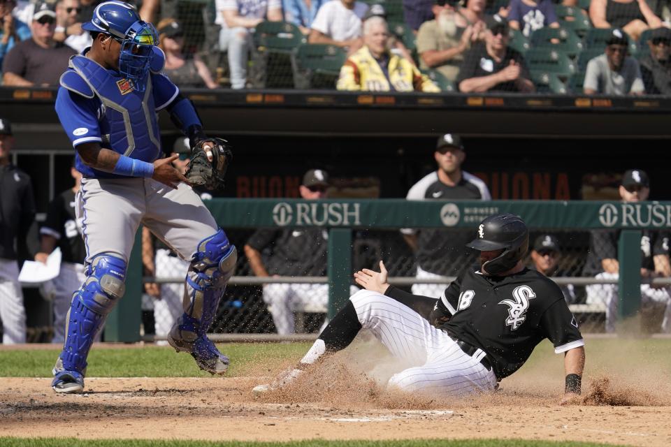 Kansas City Royals catcher Salvador Perez grabs the throw to the plate as Chicago White Sox's AJ Pollock scores on a Romy Gonzalez single in the sixth inning of a baseball game in Chicago, Thursday, Sept. 1, 2022. (AP Photo/Nam Y. Huh)