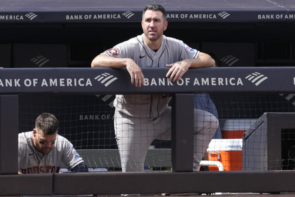 Houston Astros starting pitcher Justin Verlander watches from the dugout railing during the eighth inning of a baseball game against the New York Yankees, Saturday, Aug. 5, 2023, in New York. (AP Photo/Mary Altaffer)