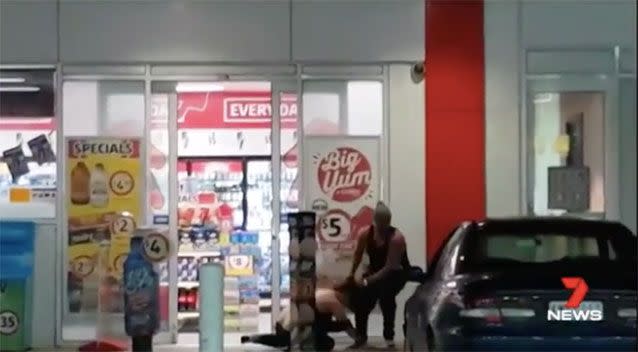 An onlooker filmed the moment a woman was dragged away. Picture: 7 News