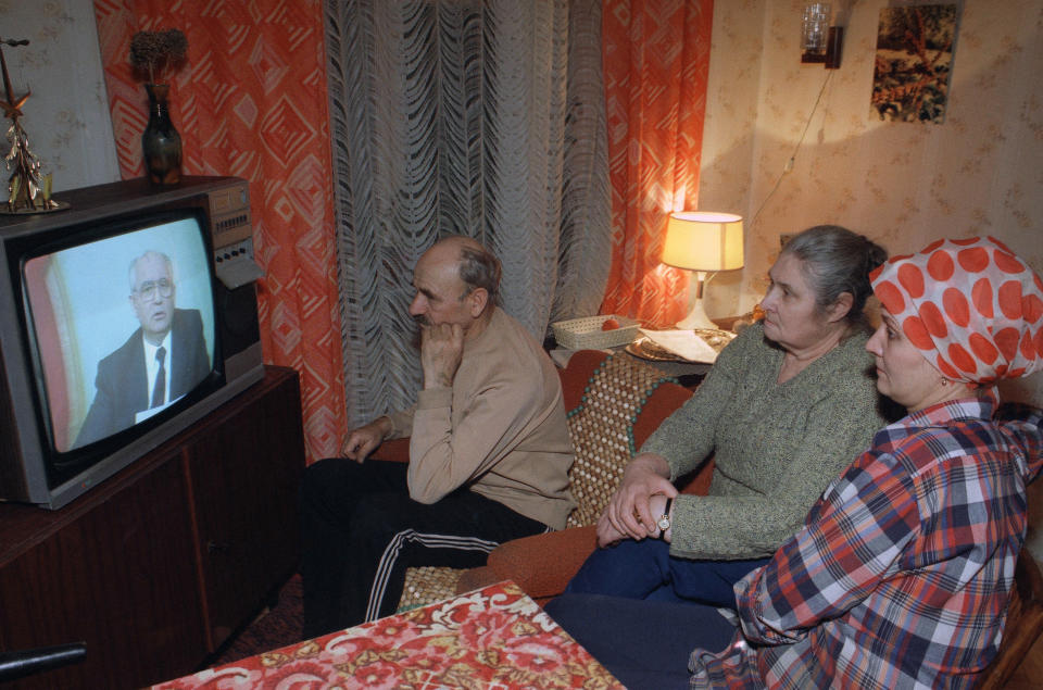 FILE - Family members watch Soviet President Mikhail Gorbachev's resignation speech on Soviet television in their downtown Moscow apartment, Russia, Dec. 25, 1991. Gorbachev announced his resignation in a live televised address to the nation on Dec. 25, 1991, drawing a line under more than 74 years of Soviet history. (AP Photo/Sergei Kharpukhin, File)