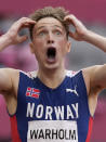 Karsten Warholm, of Norway celebrates as he wins the gold medal in the final of the men's 400-meter hurdles at the 2020 Summer Olympics, Tuesday, Aug. 3, 2021, in Tokyo, Japan. (AP Photo/Martin Meissner)