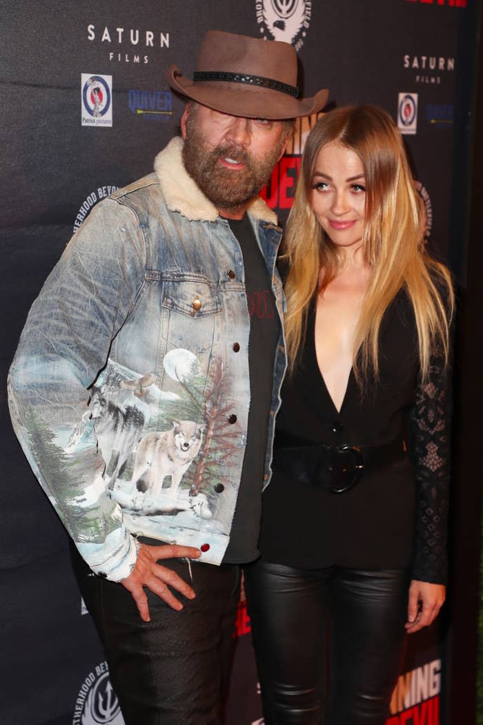 Nicolas Cage and Erika Koike in 2019 at premiere of "Running with the Devil"