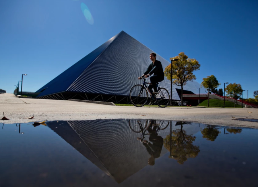 A student bikes pass the Walter Pyramid at Cal State Long Beach.(Jason Armond / Los Angeles Times)