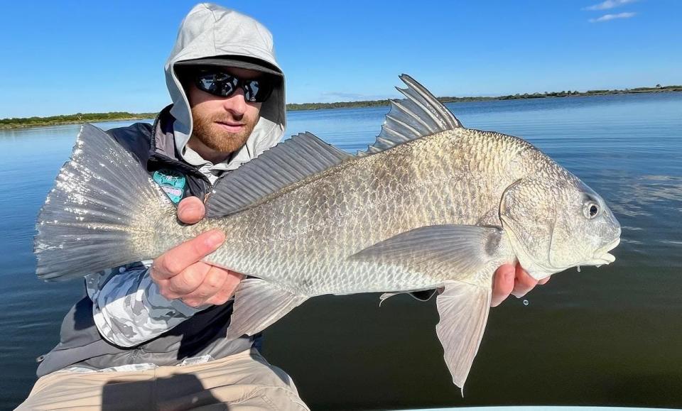 Jake Villwock with a 24-inch black drum caught on a fly in Canaveral National Seashore.