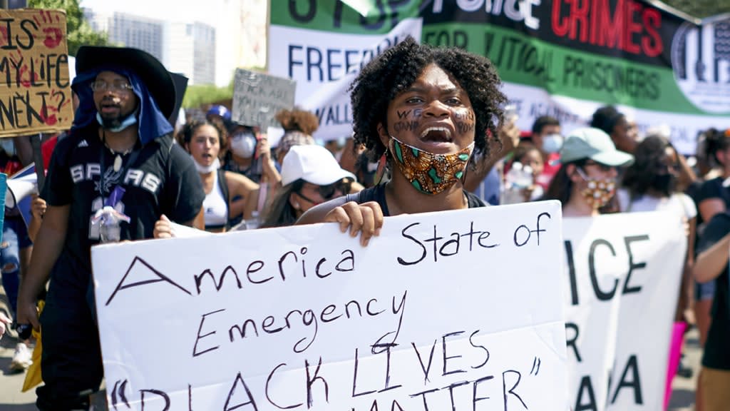 Demonstrators march during a peaceful protest against police brutality and racism on June 6, 2020 in Dallas, Texas. This is the 12th day of protests since George Floyd died in Minneapolis police custody on May 25. (Photo by Cooper Neill/Getty Images)