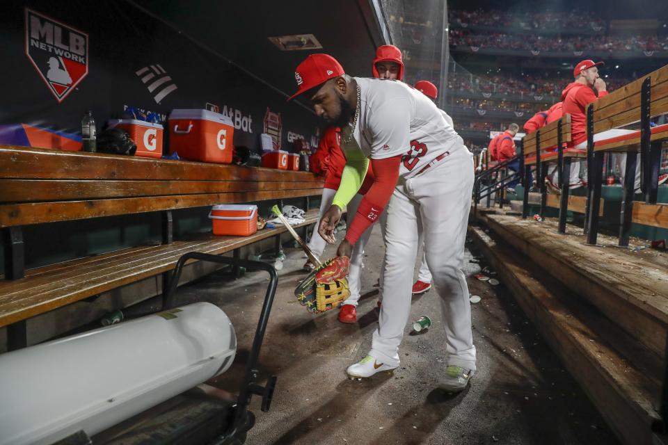 St. Louis Cardinals' Marcell Ozuna warms up during the seventh inning of Game 1 of the baseball National League Championship Series against the Washington Nationals Friday, Oct. 11, 2019, in St. Louis. (AP Photo/Jeff Roberson)