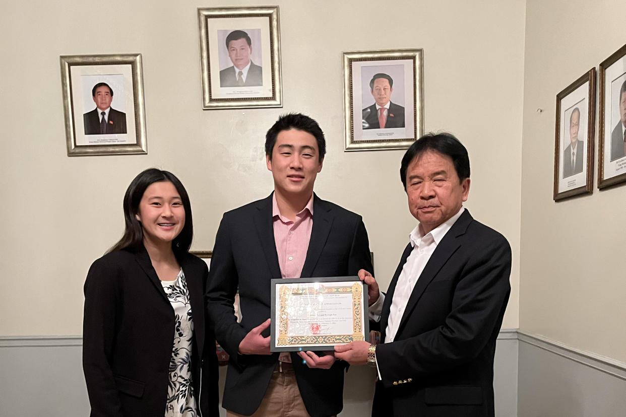 Siblings Hyleigh and Prinston Pan, high schoolers in California, were recognized by Khamphan Anlavan, Laos’ ambassador to the U.S., for their efforts to raise awareness about the secret war. (Courtesy Legacies of War)