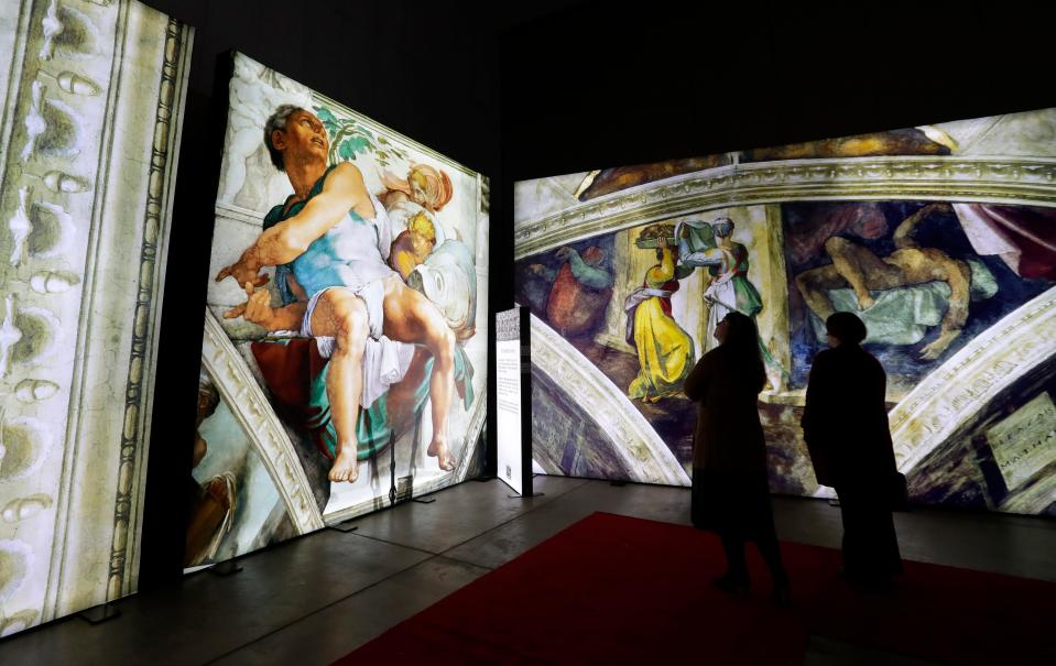 Guests tour "Michelangelo’s Sistine Chapel: The Exhibition" at the KI Convention Center in downtown Green Bay. It's open Thursdays through Sundays until Jan. 8.