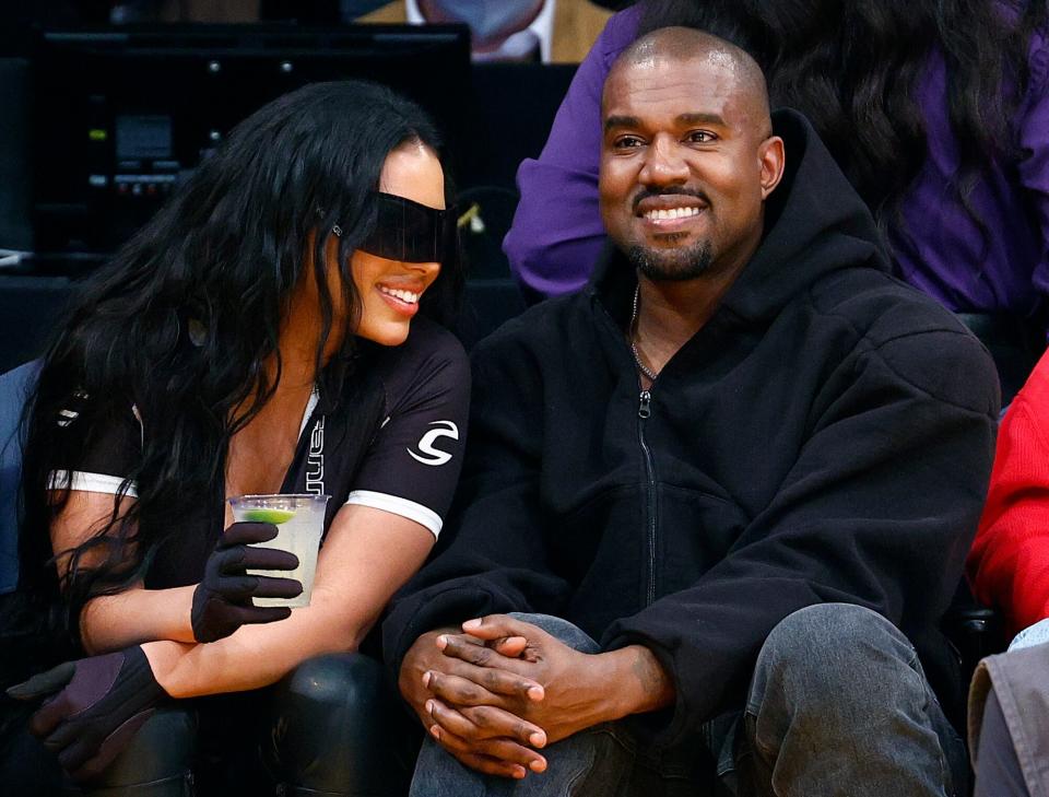 Kanye West and girlfriend Chaney Jones attend a game between the Washington Wizards and the Los Angeles Lakers in the fourth quarter at Crypto.com Arena on March 11, 2022 in Los Angeles, California. NOTE TO USER: User expressly acknowledges and agrees that, by downloading and/or using this Photograph, user is consenting to the terms and conditions of the Getty Images License Agreement