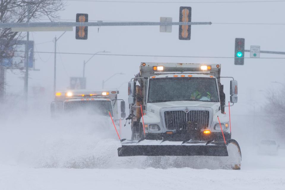 City snow plows work in tandem to clear North Topeka Boulevard after a snowstorm in February.