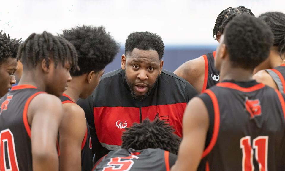 Shaw’s head coach Marv Rashad talks to his team in a Division II district semifinal against CVCA, Thursday, March 2, 2023, at Louisville.