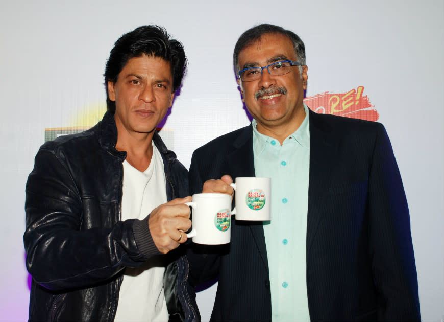 Shahrukh Khan gets a wakeup call with a strong cup of chai. Poor man really does look like he needs it!
