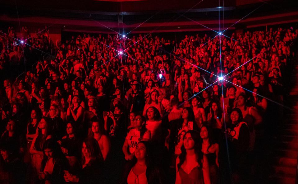 Fans sing along and dance as Olivia Rodrigo performs "vampire" during the first stop on the "Guts" tour at Acrisure Arena in Palm Desert, Calif., Friday, Feb. 23, 2024.