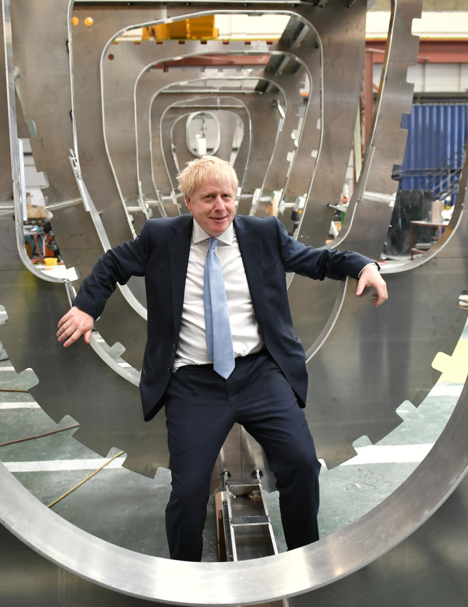 Conservative party leadership contender Boris Johnson sits in a boat under construction at the Venture Quay boatyard during a visit to the Isle of Wight.