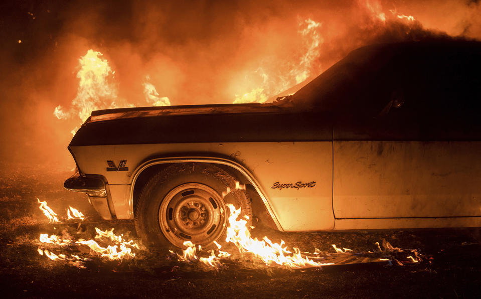 <p>CORRECTS TO JULY FROM JUNE – Flames from a wildfire consume a car near Oroville, Calif., on Saturday, July 8, 2017. Evening winds drove the fire through several neighborhoods leveling homes in its path. (AP Photo/Noah Berger) </p>