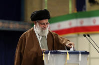 In this photo released by the official website of the office of the Iranian supreme leader, Supreme Leader Ayatollah Ali Khamenei casts his ballot in the parliamentary elections, in Tehran, Iran, Friday, Feb. 21, 2020. Iranians began voting for a new parliament Friday, with turnout seen as a key measure of support for Iran's leadership as sanctions weigh on the economy and isolate the country diplomatically. (Office of the Iranian Supreme Leader via AP)