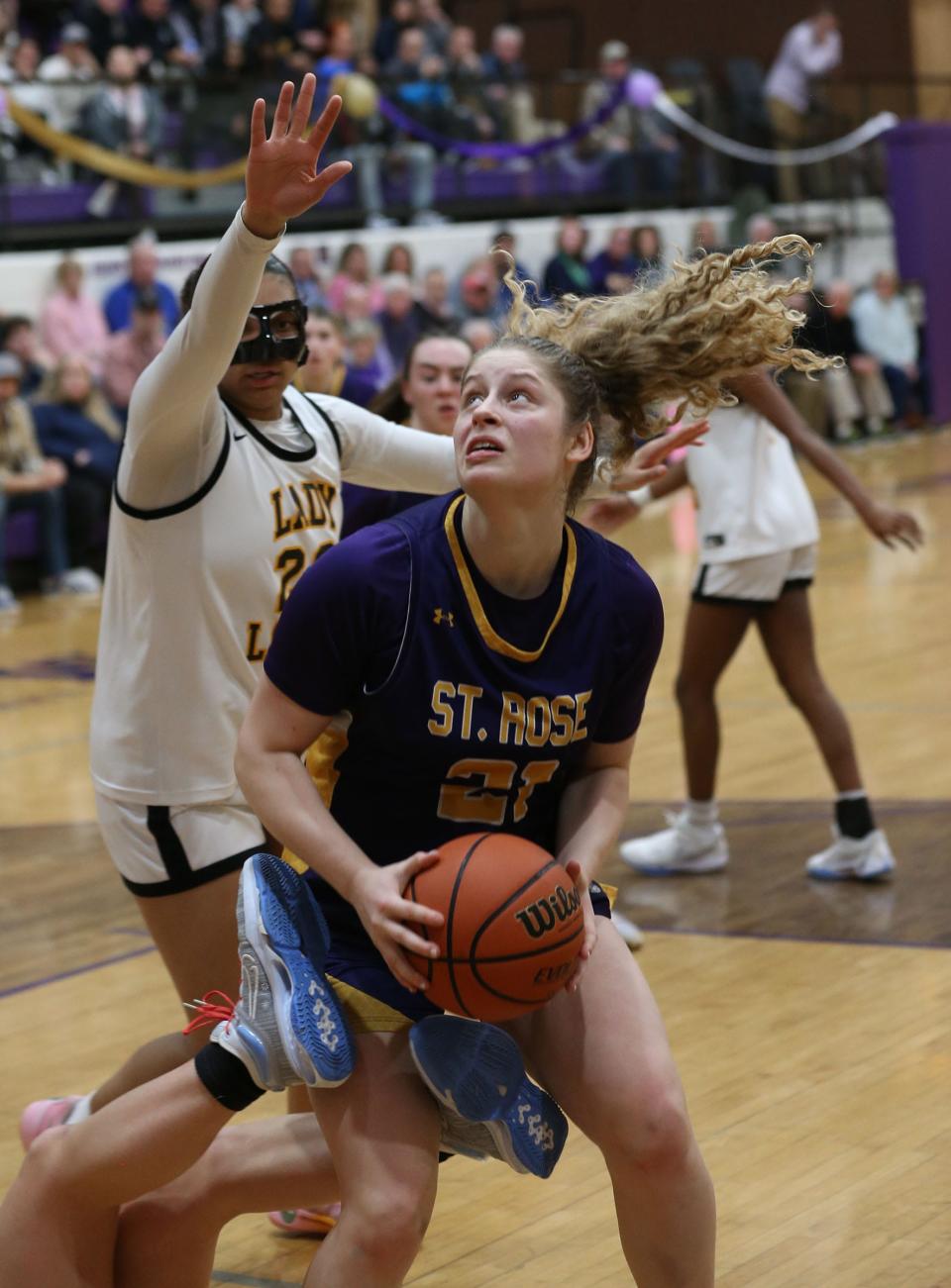 St. Rose's Jada Lynch (#21) looks for the basket around St. John Vianney's tella Lockhart (#23) during their game in Belmar Wednesday evening, January 31, 2024.