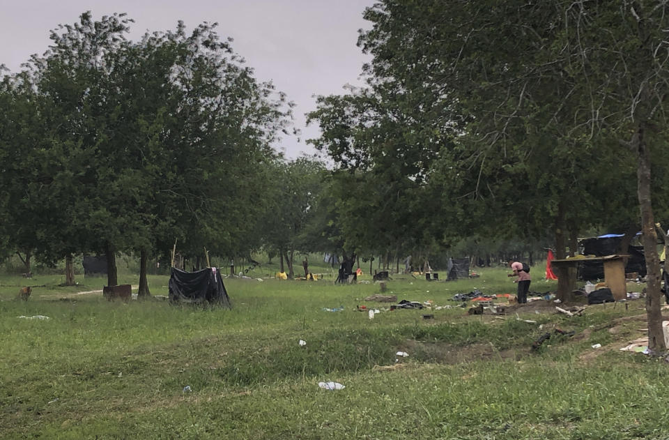 Makeshift tents and debris are seen at a migrant camp in Matamoros, Mexico, Friday, April 21, 2023. About two dozen makeshift tents in the area were set ablaze and destroyed, across the border from Texas this week, witnesses said. (AP Photo/Valerie Gonzalez)