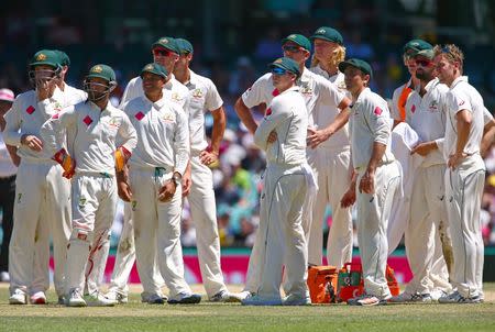 Cricket - Australia v Pakistan - Third Test cricket match - Sydney Cricket Ground, Sydney, Australia - 7/1/17 Australian players watch a replay on appeal to dismiss Pakistan's Wahab Riaz. REUTERS/David Gray