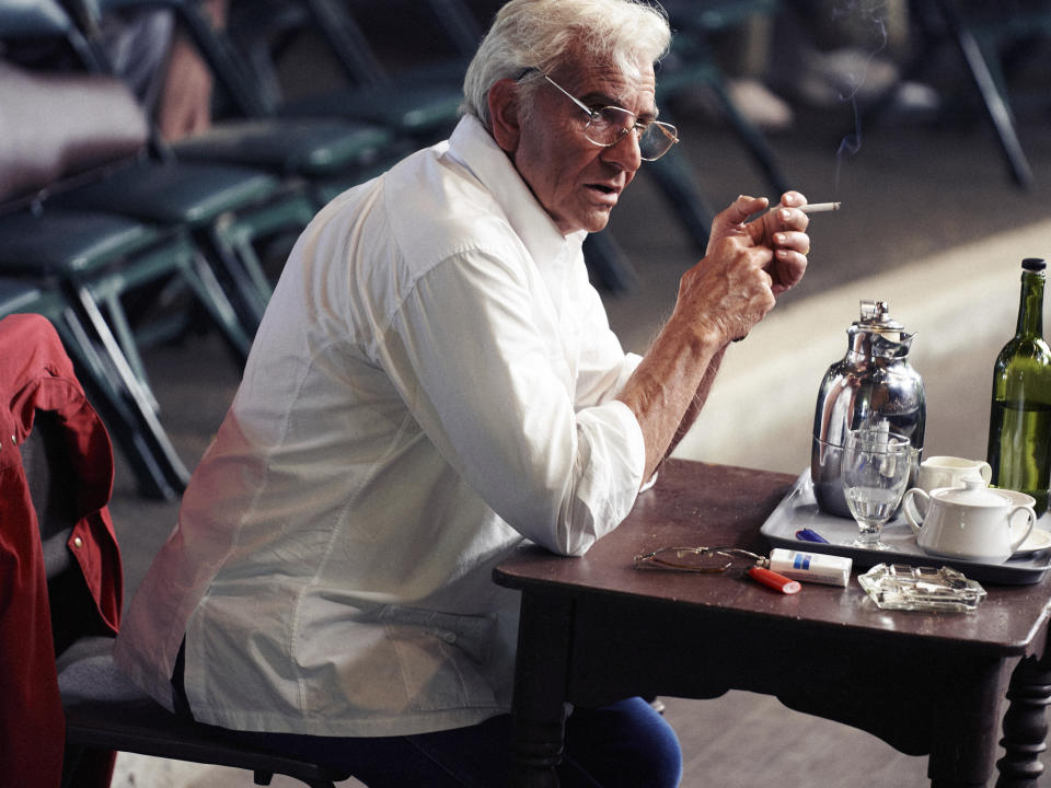 This image released by Netflix shows actor-director Bradley Cooper as Leonard Bernstein in a scene from "Maestro." (Jason McDonald/Netflix via AP)