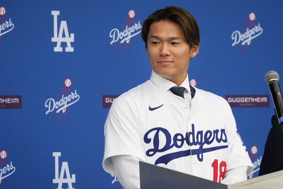 Yoshinobu Yamamoto speaks during his introduction as a new member of the Los Angeles Dodgers baseball team Wednesday, Dec. 27, 2023, in Los Angeles. (AP Photo/Damian Dovarganes)