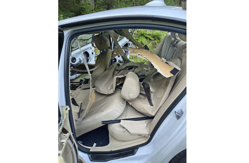 This July 15, 2024, photo shows the damage caused by a bear and cub that broke into a car, and became trapped inside, in Winsted, CT, until freed by state environmental conservation police. It turned out to be the first of three episodes involving bears in Connecticut over six days that were publicly reported by the state Department of Energy and Environmental Protection — another sign of the increasing black bear population in the state. (AP Photo)
