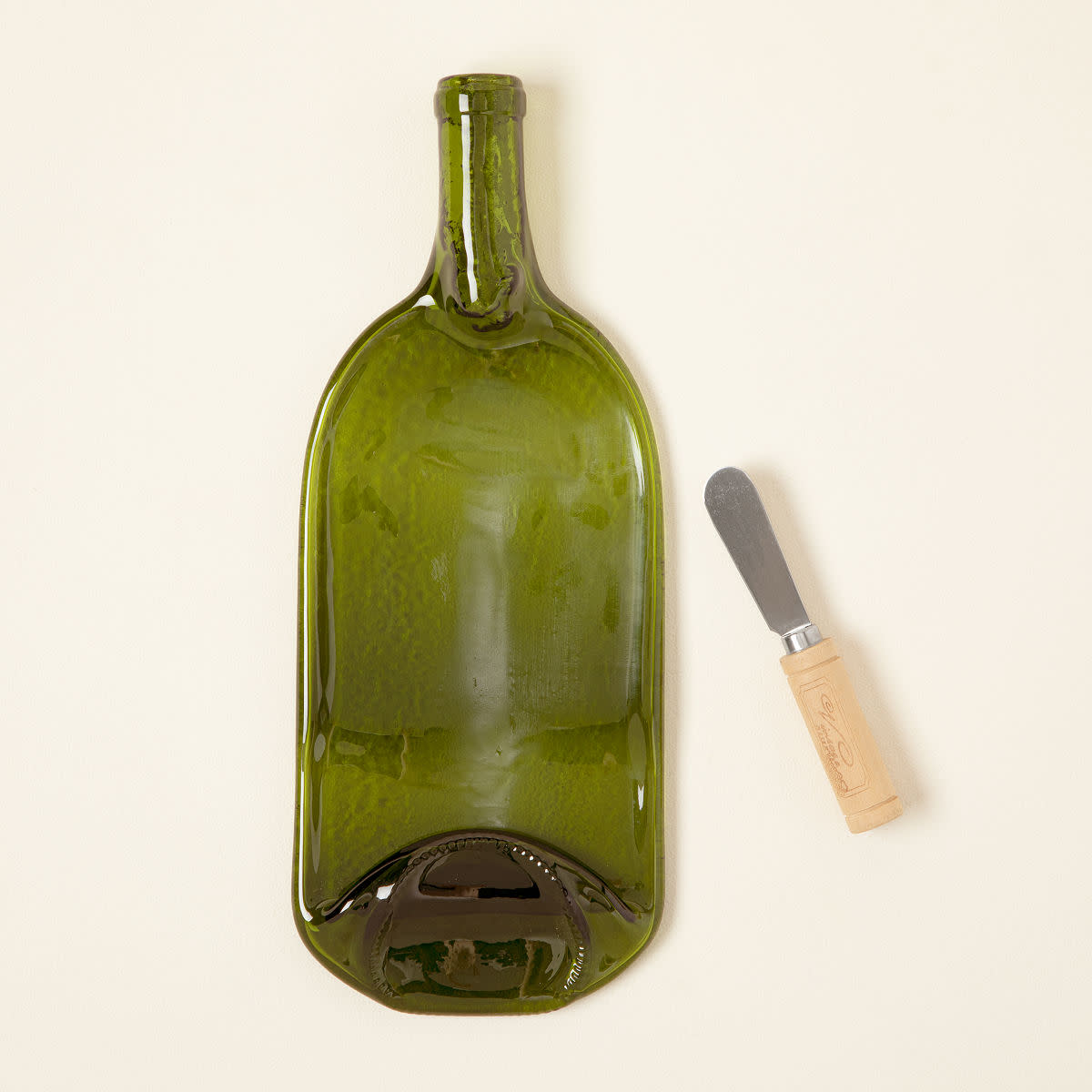 <p><a href="https://go.redirectingat.com?id=74968X1596630&url=https%3A%2F%2Fwww.uncommongoods.com%2Fproduct%2Frecycled-wine-bottle-platter-with-spreader&sref=https%3A%2F%2Fwww.delish.com%2Fholiday-recipes%2Fg2582%2Fwine-gifts%2F" rel="nofollow noopener" target="_blank" data-ylk="slk:Shop Now;elm:context_link;itc:0;sec:content-canvas" class="link rapid-noclick-resp">Shop Now</a></p><p>Val Huegrich Recycled Wine Bottle Platter with Spreader</p><p>Uncommon Goods</p><p>$24.00</p><span class="copyright">Val Huegerich</span>