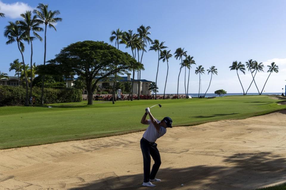 Jake Knapp hits his bunker shot on the 16th hole during the third round of the Sony Open in Hawaii golf tournament at Waialae Country Club. Mandatory Credit: Kyle Terada-USA TODAY Sports