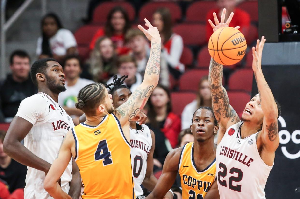 Louisville guard Tre White grabs a rebound in the second half Wednesday night against Coppin State.