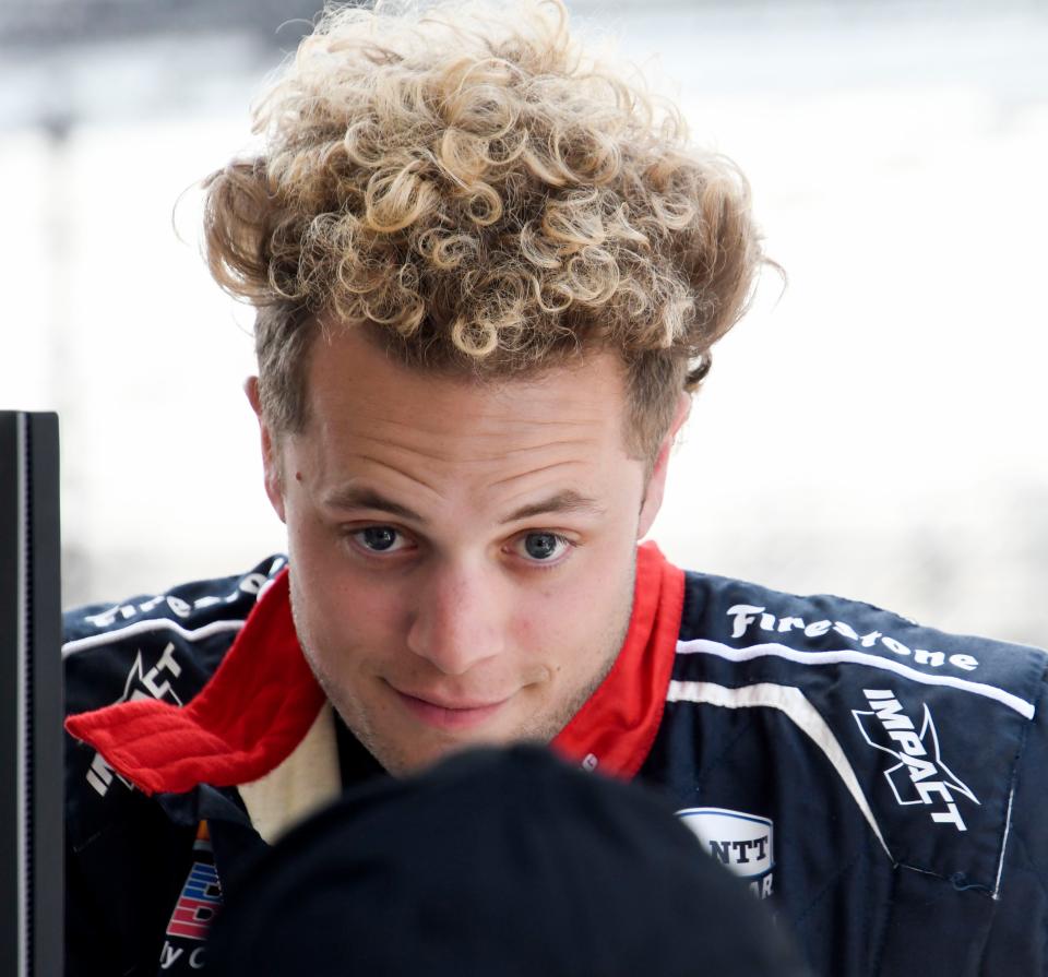 A. J. Foyt Enterprises driver Santino Ferrucci (14) talks with A.J. Foyt in his pit box Monday, May 22, 2023, during practice ahead of the 107th running of the Indianapolis 500 at Indianapolis Motor Speedway. 