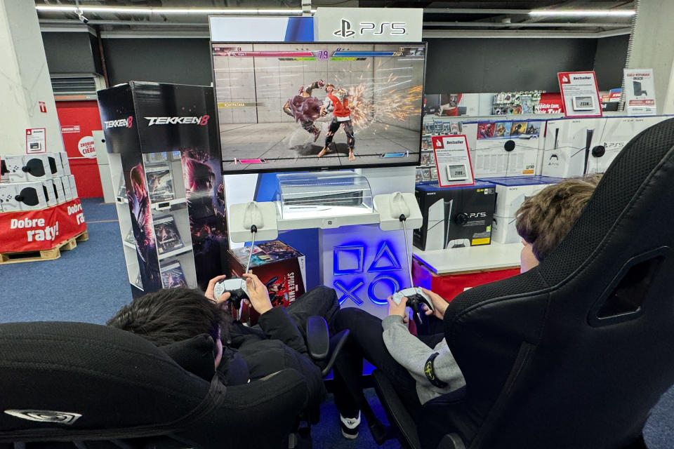 People play PlayStation 5 console at the store in Krakow, Poland on February 21, 2024. (Photo by Jakub Porzycki/NurPhoto via Getty Images)