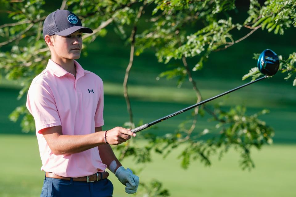 Colton Moore lines up his shot at the first tee box during the First National Bank Junior Golf Tour, Thursday, July 21 at Wilkshire Golf Course in Bolivar.