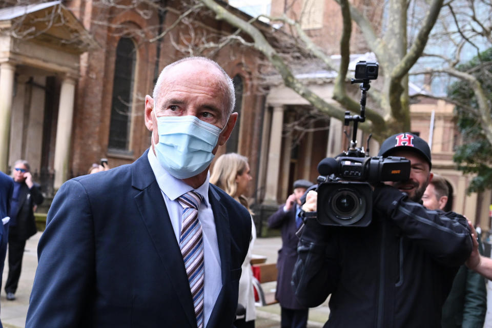 Chris Dawson (left) arrives at the Supreme Court of New South Wales in Sydney, Tuesday, August 30, 2022.