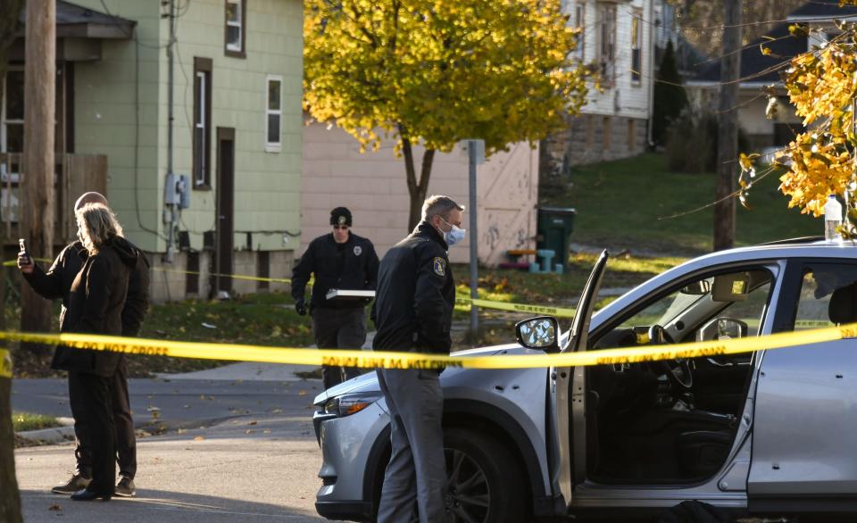 Capt. Robert Backus of the Lansing Police Dept. and others investigate a shooting that sent two people to the hospital Monday, Nov. 22, 2021, near the intersection of Norman and Herbert Streets, just west of S. Cedar Street. The incident is still under investigation.